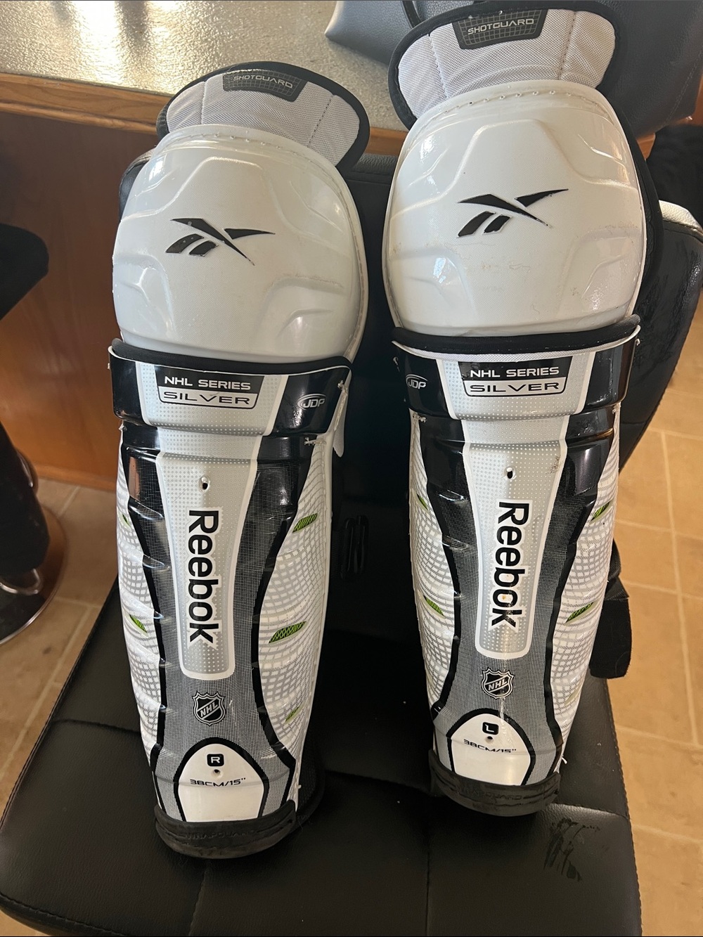 Reebok White and Black NHL Series Shin Guards with Green Accents